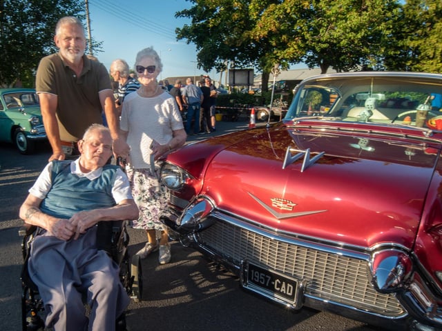 Admiring the vintage American Cadillac are resident Andy Clarke and Alan and Mary Clarke.