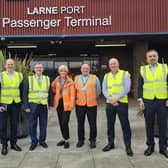 DUP leader Sir Jeffrey Donaldson (third from left) and colleagues Sammy Wilson MP and Gordon Lyons MLA are welcomed to Larne Port. Photo submitted by the DUP