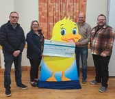 Members of Moree Community Association handing over a cheque for £1,000 to Charis Cancer Care. The cheque is the proceeds of the annual Duck Race which took place in August. Credit: Supplied