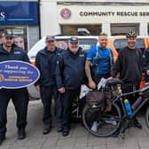 Terry Geddis with members of the Community Rescue Service outside the Coleraine shop. Terry cycled over 1,100 miles around Ireland to raise funds for CRS and the Zachary Geddis Break the Silence Trust. Credit: ZGBTS