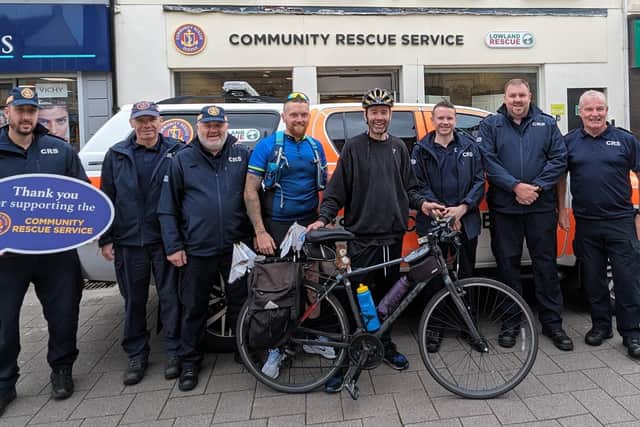 Terry Geddis with members of the Community Rescue Service outside the Coleraine shop. Terry cycled over 1,100 miles around Ireland to raise funds for CRS and the Zachary Geddis Break the Silence Trust. Credit: ZGBTS