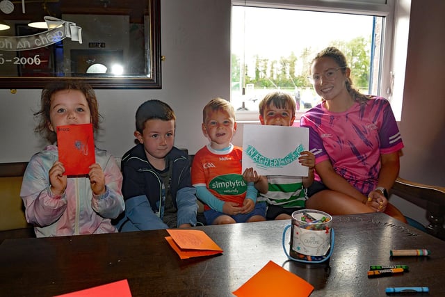 Leader Casey Carvill pictured with children who enjoyed an arts and crafts morning at the Healthy Kidz Summer Camp. PT31-204.