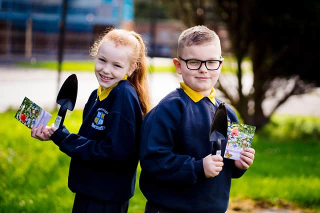 Pupils from Abbots Cross Primary School happy with their coronation trowels and wildflower seeds.