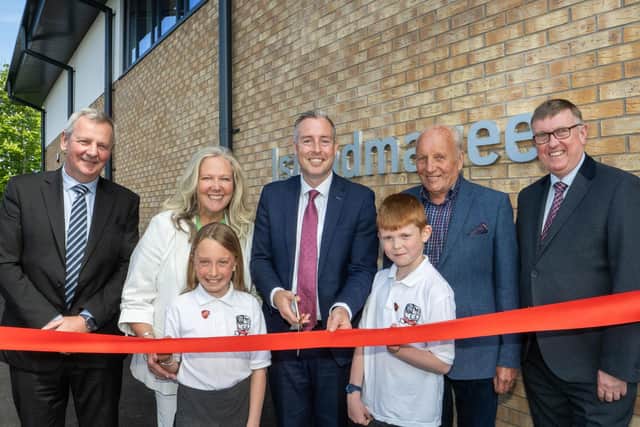 Pictured at the official opening ceremony are, from left to right, chief executive of the Education Authority (EA), Richard Pengelly; principal of Islandmagee Primary School, Arlene Cambridge; Education Minister Paul Givan; chair of the board of governors, William Kane; chair of the board of the EA, Mervyn Storey and pupils, Sara-Jayne and George. Photo@ submitted