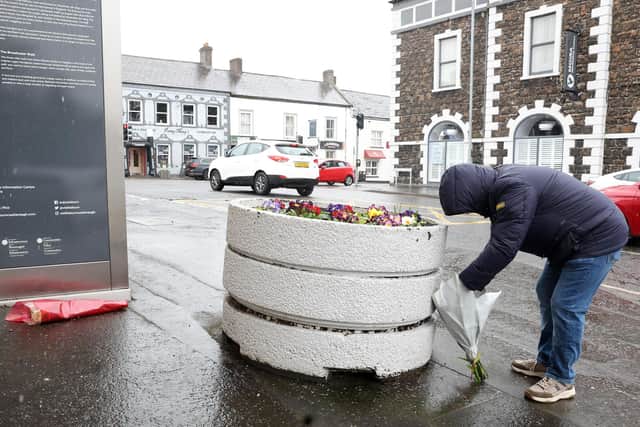 Flowers left at the scene on the corner of Meeting Street and Main Street in Moira, where one-year-old Frank McIlduff died after a collision involving a lorry.   Picture: Jonathan Porter/PressEye