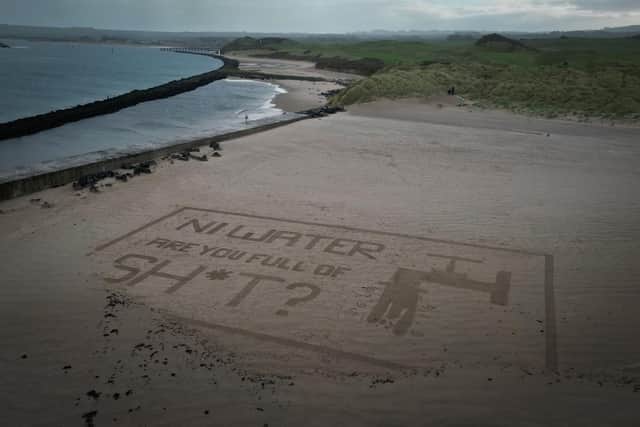 Act Now's sand art stunt targeting NI Water at Castlerock Beach last Saturday