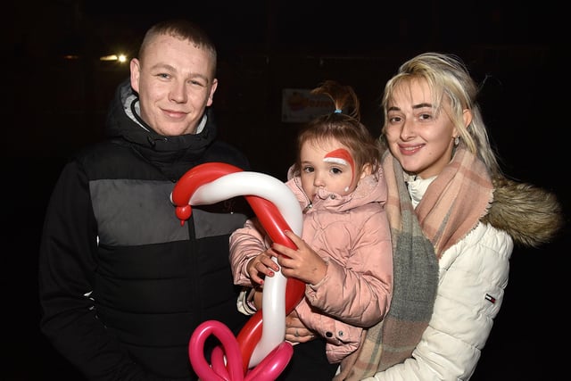 Enjoying the festivities at the Christmas lights switch on at the Mayfair Business Centre, Garvaghy Road, are Ryan McGeown and Amy Sharpe and daughter Isla-Rose McGeown. PT50-253.