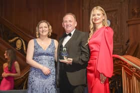 Bannview House Deputy Manager Leah Waldell (left) accepts ‘Care Home of the Year’ Award from the presenters.