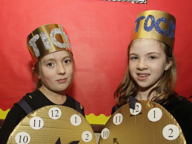 TIME ON THEIR HANDS. Two pupils from P3/4 at St Brigid's PS who took to the stage during their Christmas Play with 'Clocks Countdown to Christmas' in 2008