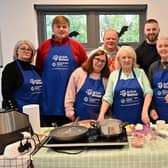 Residents learn new skills and knowledge about food at a healthy eating workshop. Pictured include Maire Scott, from Lagmore Community Forum (front row, left), and Stuart Lavery, Housing Executive Good Relations Officer (back row, right). Pic credit: Simon Graham