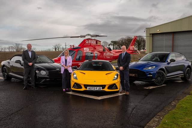 From L-R- Harry Tregenna, Bentley Belfast Sales Manager, Charles Hurst, Colleen Milligan, Air Ambulance NI, Mike Gimson, Aston Martin Belfast Sales Manager, Charles Hurst