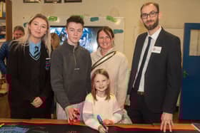 Taking part in an open night activity.