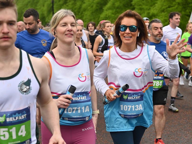 A cheery wave from this runner.