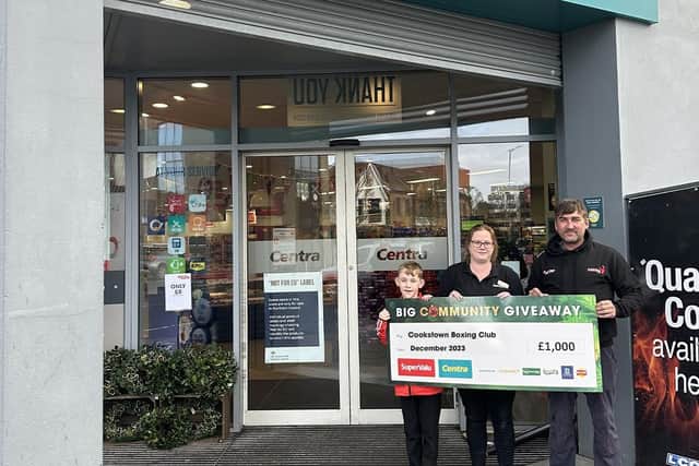 Adrian Kelly from Cookstown Boxing Club and club member Tom Coyle (left) visit Centra Burn Road Cookstown, where store supervisor Nicola Young  presents them with a donation of £1,000 from SuperValu and Centra’s £40K Big Community Giveaway. Credit: Submitted