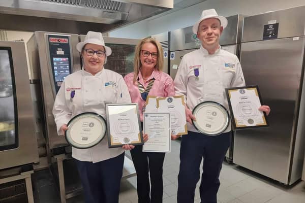 Darren Taggart, Causeway Hospital Head Cook and Angela Dickson, Causeway Hospital Cook, celebrate their success at the NHS 4 Nations Chef Challenge with Karen McLaughlin, Chair of the NI Branch of the Hospital Caterers Association and General Manager for Catering and Domestic Services within the Northern Trust. CREDIT NORTHERN TRUST