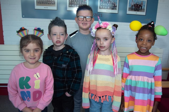 Year 1 and 2 pupils posing with their funky hairstyles including from left, Sofia, Joel, Dilanas, Lucy and Advany. PT12-243.