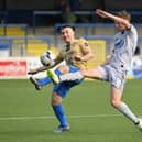 Coleraine’s Josh Carson and Newry’s Brian Healy battle for possession. Pictures: INPHO/Stephen Hamilton