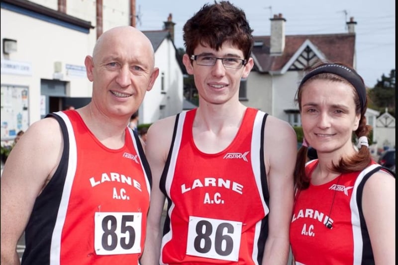 John and Michael McCann with Rhonda Brady in their Larne colours in 2011.