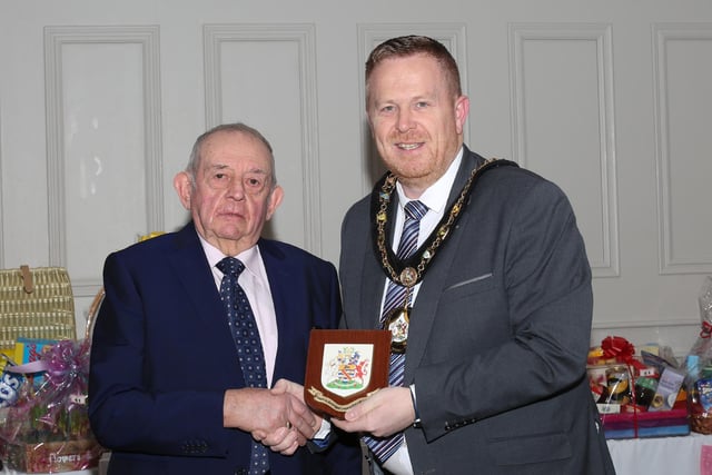 Lord Mayor of Armagh City, Banbridge and Craigavon Borough Council, Councillor Paul Greenfield presents charity events organiser John Wilson MBE with a borough plaque.