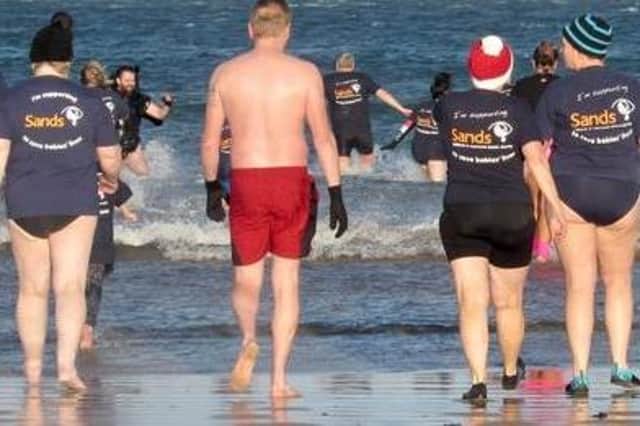The annual Splish Splash Splosh event to raise money for SANDS NI will take place on New Year's Day at 11.30am on Portstewart Strand. Credit Donal Macauley