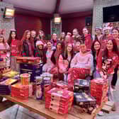 Players from Ballyclare Ladies' Hoceky Club's U15 side have packed bags of festive treats to give to residents in need this Christmas. (Pic: Love Ballyclare).