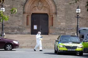 Police at St Patrick's Church, Downpatrick, where a priest was seriously assaulted. Photo: Press Eye