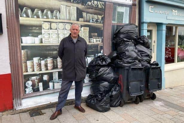 Cllr Alex Swan (UUP) has voiced his 'disappointment' as uncollected rubbish in Lisburn piles up on the streets