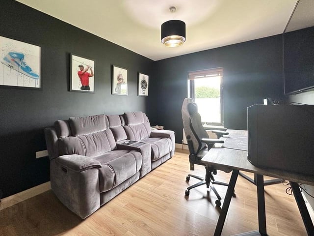 Family room suitable for a number of uses such as a home office, a fifth bedroom option or as an additional reception room. Complete with laminate wood flooring.