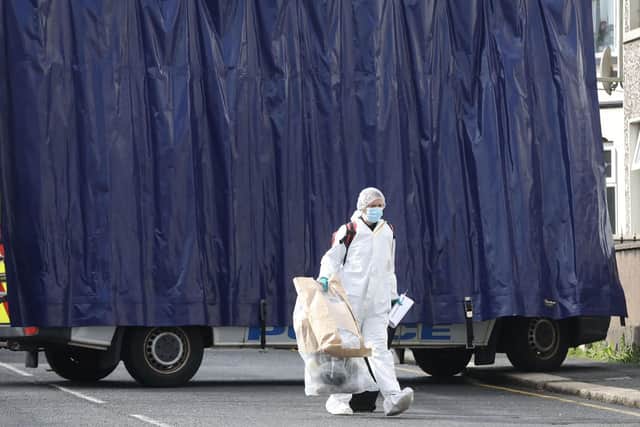 A large blue screen in place as police carry out investigations into the death of a woman in Portadown.