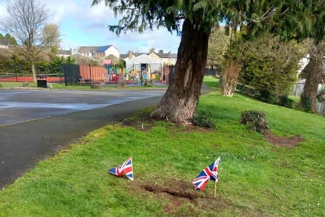 The signposted was replaced by two small Union flags.