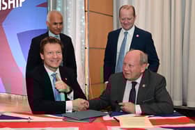 The TUV and Reform UK leaderships signing a pact earlier this year, which was fundamentally undermined by new leader Nigel Farage on Monday.