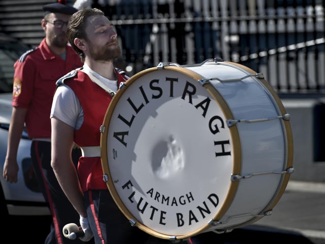 The Allistragh Flute Band drummer lost in the music, as they parade around the town centre.