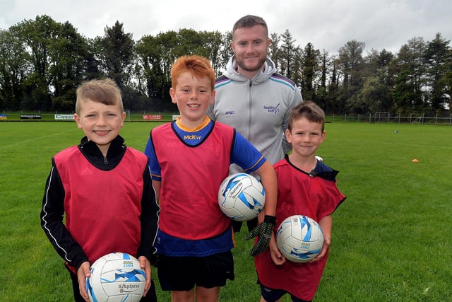 Coach Conor Larkin pictured with some of the boys who attended the Healthy Kidz Summer Camp in Maghery. PT31-213.