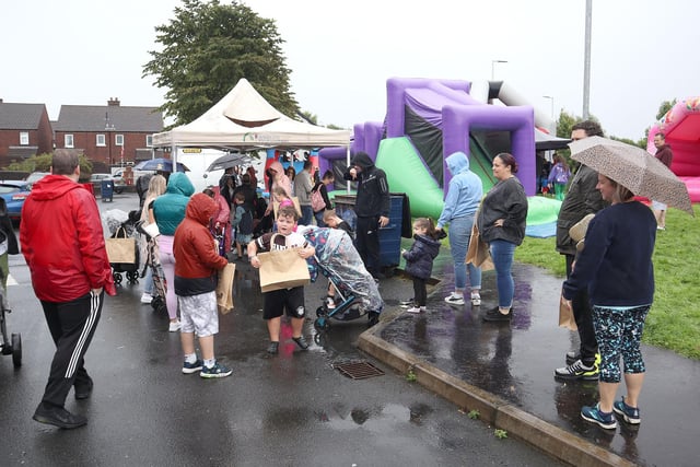 Residents dodged the showers to enjoy the event.