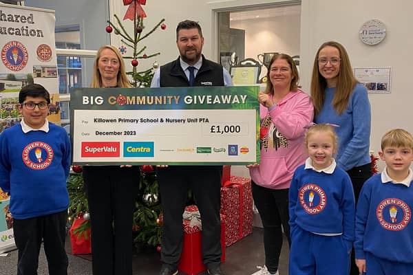 Mrs Watson (left), Principal of Killowen Primary School and Nursery Unit, and PTA members Lorna Featherstone and Samantha Martin, welcome SuperValu store manager Martin Reynolds to the school as he presents the PTA with a donation of £1,000 from the SuperValu and Centra £40K Big Community Giveaway. They are joined by pupils (from left) Ayaan, Annie and Joseph. Pic credit: Musgrave Northern Ireland