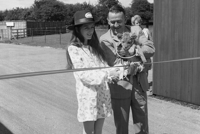 The Hon Isobella Lambton cuts a tape to mark the official opening of Lambton Lion Park in 1972.