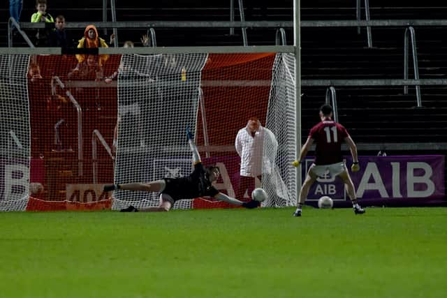 Ballybay's Shane McGuinness scores a penalty against Crossmaglen's Conor Deery