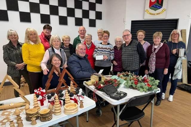 Chairman Gerry Hamill and Secretary David Thornton giving a woodworking demonstration at Seagoe Community Hub. The group was awarded a £20,000 grant from The National Lottery Community Fund to build a permanent shed structure so they have a safer, more accessible space for their members.