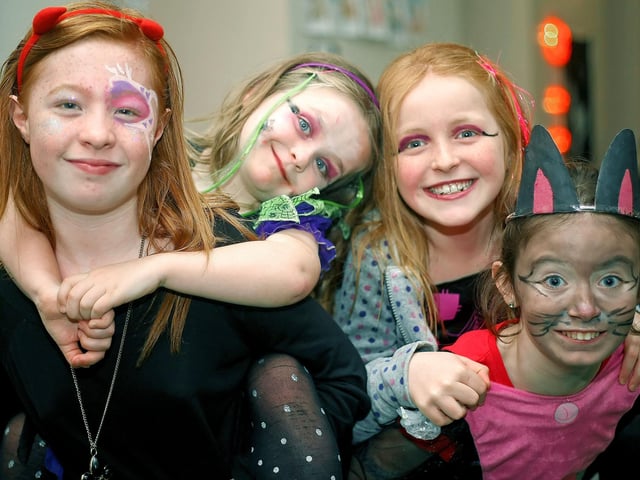 Smiling for the camera are these four children pictured enjoying Ballycastle Scouts Halloween Party. in 2009.