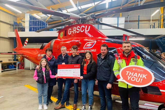 Pictured at the Air Ambulance NI headquarters in Lisburn are Kathryn Hutchinson, Linda Hutchinson, William Hutchinson, Brian Hutchinson, Claire Hutchinson,  and Andrew Moore.