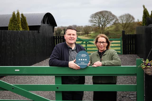 Alison Leslie, Quality Assurance Manager at Tourism NI pictured with Dermot Friel, owner of Fairy Tree Lodges.