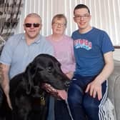 Portadown man Les Massey with his Guide Dog Munro, his wife Stephanie and his son Reece. Les is hoping for more volunteers for his Co Armagh Tail Blazers group which helps raise money for Guide Dogs NI.