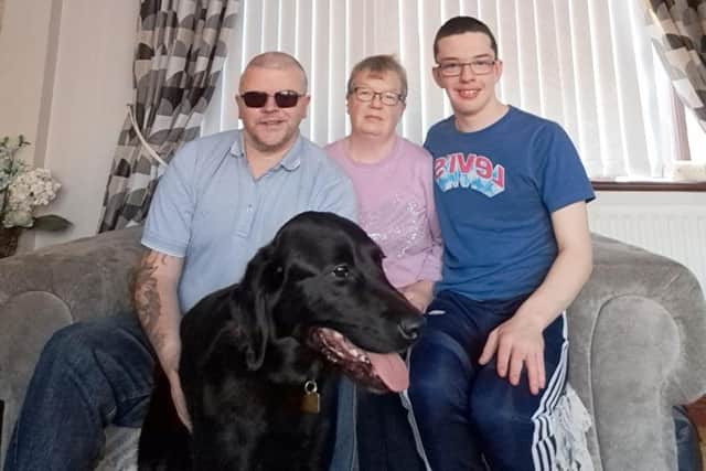 Portadown man Les Massey with his Guide Dog Munro, his wife Stephanie and his son Reece. Les is hoping for more volunteers for his Co Armagh Tail Blazers group which helps raise money for Guide Dogs NI.