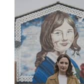 Playwright and actress Charlotte McCurry at the mural dedicated to her aunt Julie Livingstone. Her play, ‘Julie’ produced by Kabosh Theatre Company will be performed at the Old Church in Cushendun on August 17. CREDIT KELLY PR