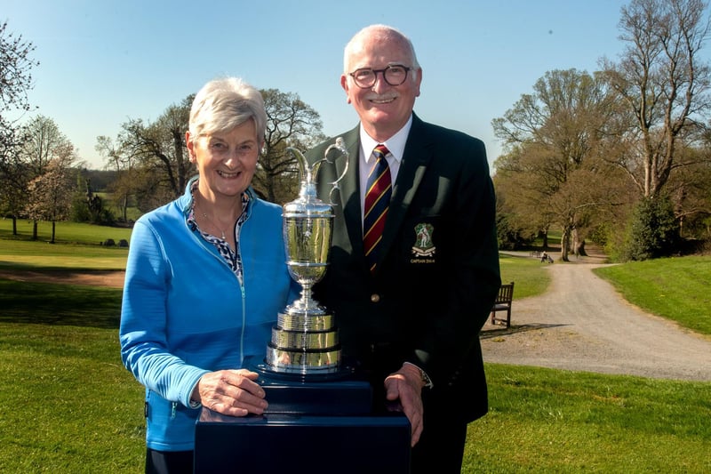 Famous faces at Portadown Golf Club, Ann Walker and Dave Allen posing with a famous trophy. PT14-308.