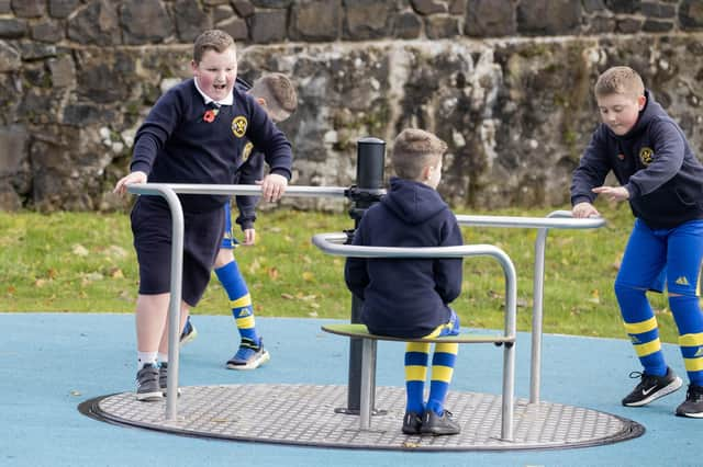 Children enjoying the new play equipment at Armoy Playpark.