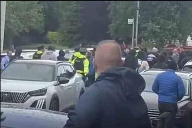 A screen shot from footage of the parade last year, with dozens of police chasing people down the main street of Scarva.
