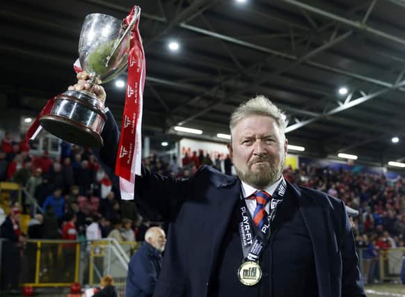 Portadown manager Niall Currie with the Playr-Fit Championship trophy.