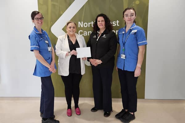 Sperrin Unit Staff Nurse Gillian Edgar and Staff Nurse Kamara McElhinney accept the kind donation from Ria and Susan Forgie.   Credit WHSCT