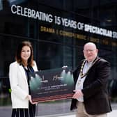 Theatre at Mill manager, Katherine Gardiner and Mayor of Antrim and Newtownabbey, Councillor Neil Kelly pictured outside the venue celebrating 15 Years of Spectacular Storytelling.